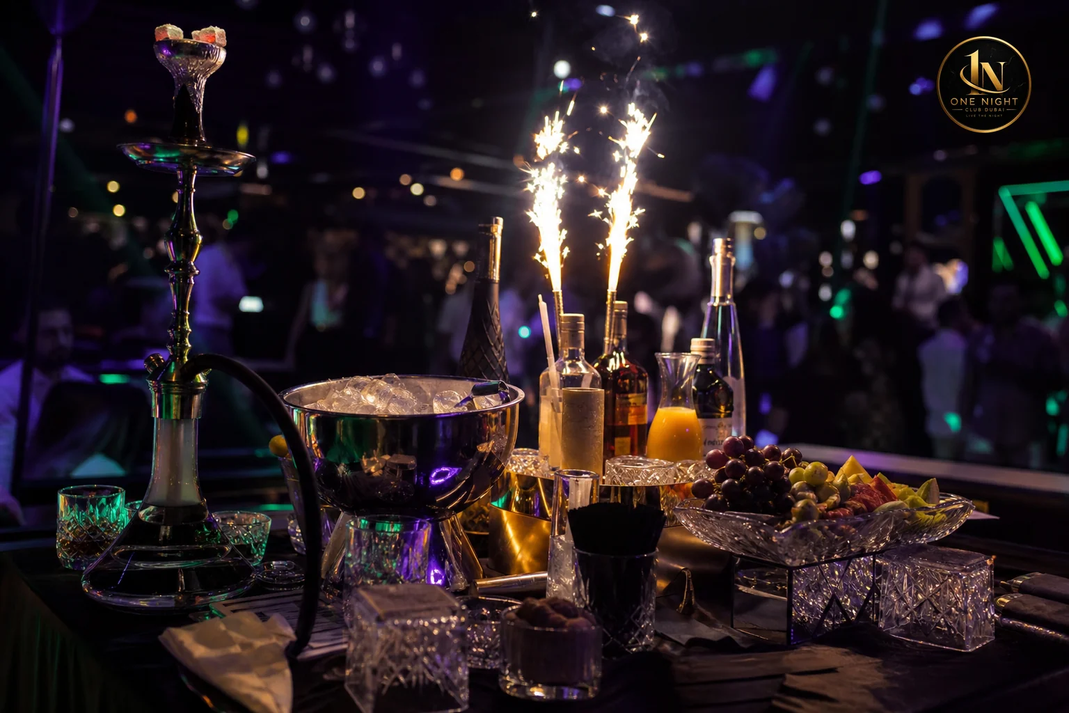 Close-up of a VIP bottle service table setup with sparklers, glasses, and shisha at a Dubai nightclub. Photorealistic close-up photograph of a VIP nightclub table in Dubai at night, bottles with lit sparklers, crystal glasses, a shisha pipe